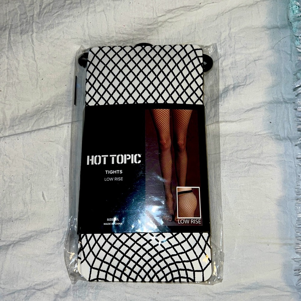 Hot Topic Size M/L Never worn still in package Low rise black fishnet tights.